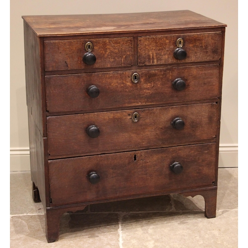 813 - A George III oak chest of drawers, formed with an arrangement of two short and three graduated long ... 