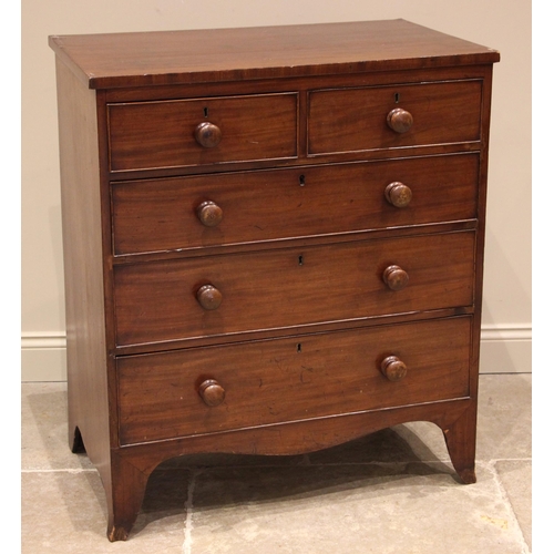 814 - An early 19th century mahogany chest of drawers, formed with two short and three long graduated and ... 