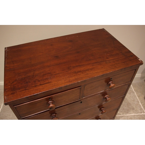 814 - An early 19th century mahogany chest of drawers, formed with two short and three long graduated and ... 