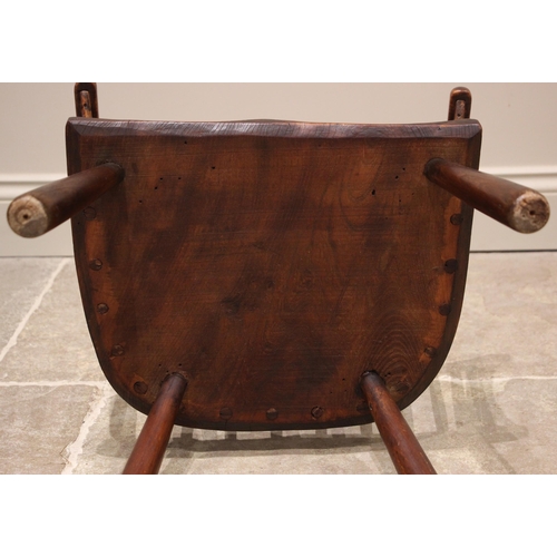 815 - A primitive Welsh ash, elm and beech comb back chair, early 19th century, the stick back and curved ... 