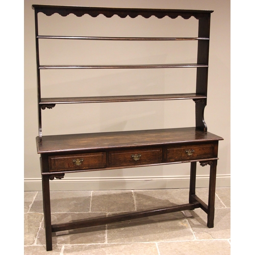 829 - A George III style oak dresser, late 19th century, the open plate rack with a moulded cornice and wa... 