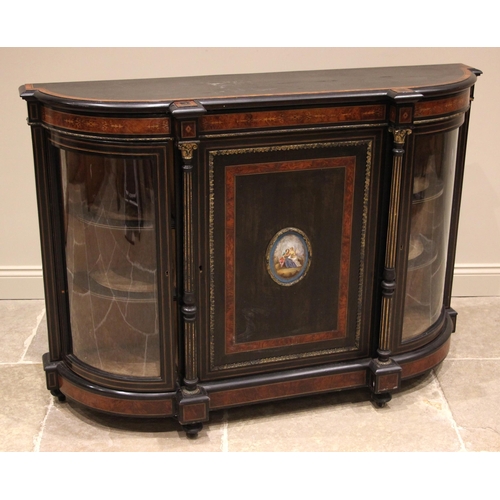 835 - A Victorian ebonised and amboyna banded credenza, of bowfront form, the central cupboard door applie... 