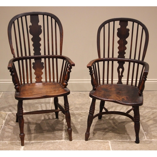 847 - A 19th century elm and ash hoop back Windsor farmhouse elbow chair, with a shaped and pierced splat ... 