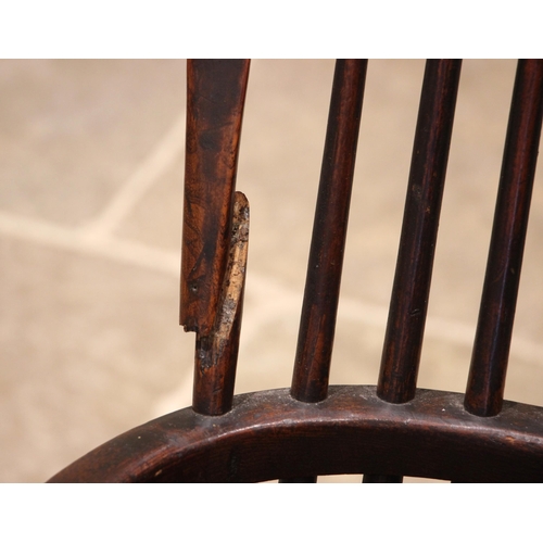 847 - A 19th century elm and ash hoop back Windsor farmhouse elbow chair, with a shaped and pierced splat ... 