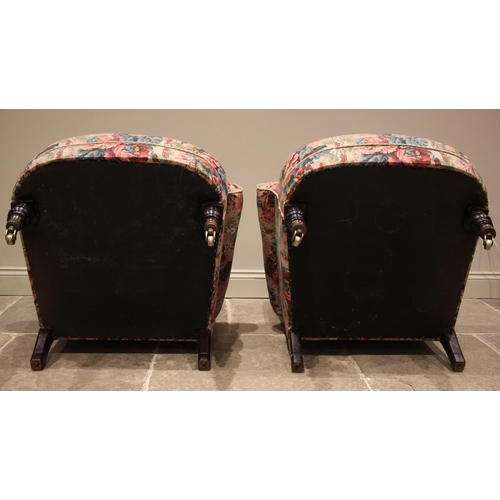 854 - A near pair of deep-seated armchairs, in the manner of Howard & Sons, late 19th/early 20th century, ... 