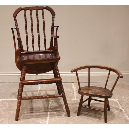 855 - A primitive elm and ash child's chair, 19th century, with a stick back, shaped and figured elm seat ... 