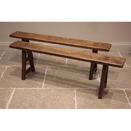 857 - A pair of oak benches or forms, 19th century, each with a plank top upon splayed legs of square sect... 