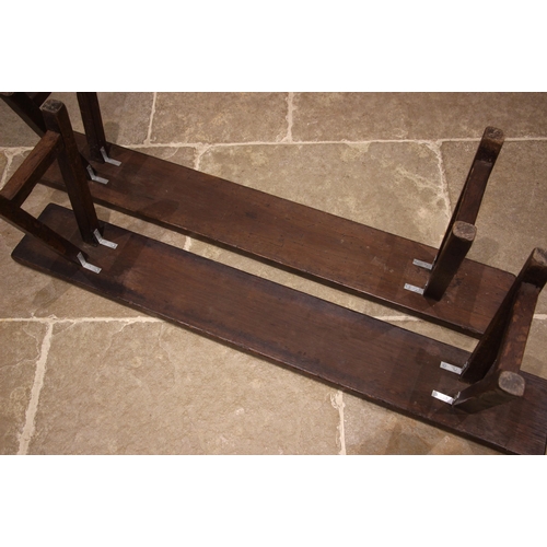 857 - A pair of oak benches or forms, 19th century, each with a plank top upon splayed legs of square sect... 