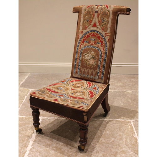 861 - A Victorian mahogany prie dieu chair, in arcaded Gothic needlepoint fabric, the 'T' shaped back and ... 