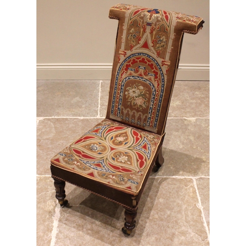 861 - A Victorian mahogany prie dieu chair, in arcaded Gothic needlepoint fabric, the 'T' shaped back and ... 