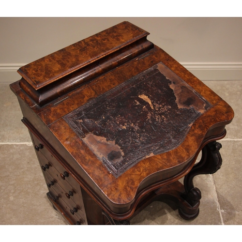 868 - A Victorian burr walnut serpentine davenport, the hinged writing slope with inset leather skiver (sk... 