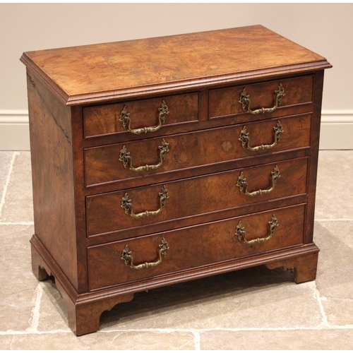 872 - A figured walnut chest of drawers, 19th century and later, of cottage proportions, the moulded top o... 