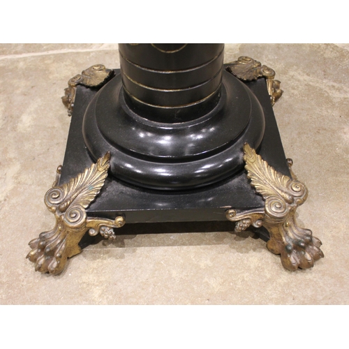 875 - An Empire Movement ebonised hardwood pedestal, late 19th century, the tapering fluted column applied... 