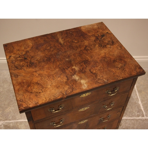 887 - A burr walnut bachelors chest of drawers, early 20th century, the book veneered top over an arrangem... 