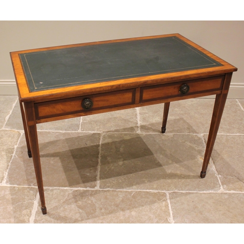 899 - An Edwardian satinwood and mahogany cross banded Sheraton revival writing desk, the top inset with a... 