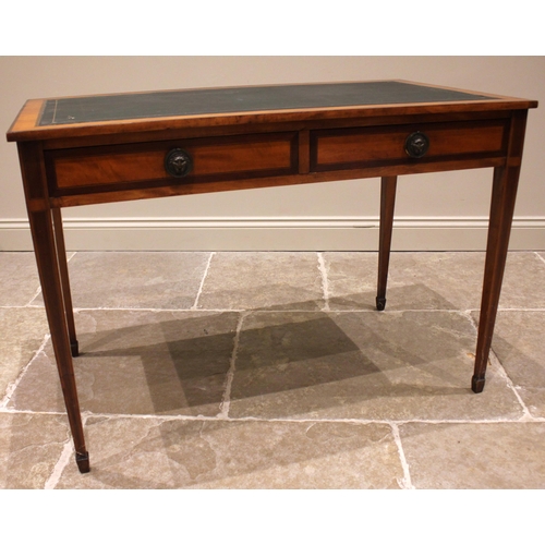 899 - An Edwardian satinwood and mahogany cross banded Sheraton revival writing desk, the top inset with a... 