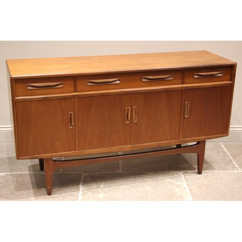 903 - A teak 'Long John' sideboard, mid 20th century, formed with one long and two short drawers over four... 