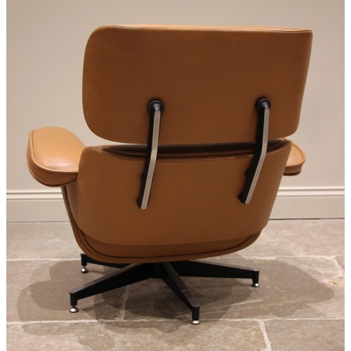 908 - Manner of Charles and Ray Eames for Herman Miller: a tan leather revolving lounge chair with conform... 