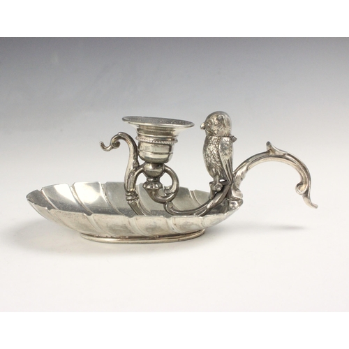 96 - A silver plated novelty chamberstick, the scroll handle with owl shaped vesta with hinged head, abov... 