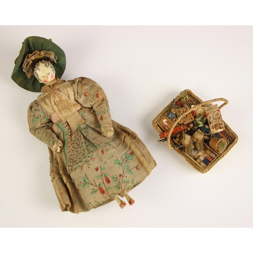 251 - A Victorian peddlers (pedlar) peg doll, mid to late 19th century, modelled as a lady in floral dress... 