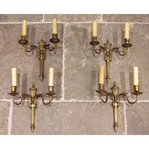 688 - A set of four brass Adam style two branch wall light fittings, 20th century, each of urn and taperin... 