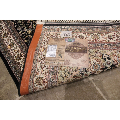 721 - A black ground fine woven Iranian rug, the all over floral design with a central lozenge medallion, ... 