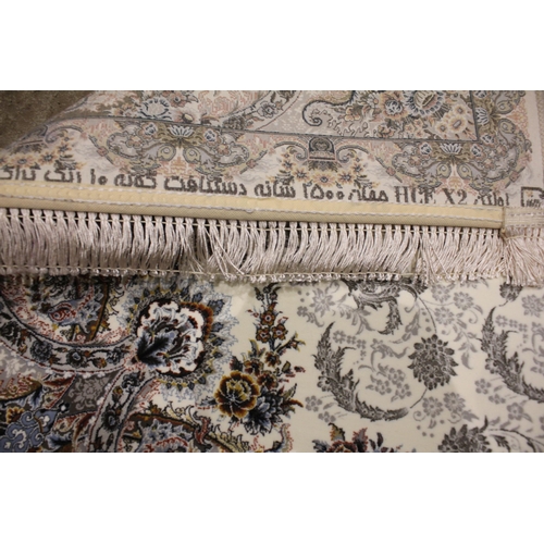 722 - A fine woven Iranian runner, the ivory ground centred with a pair of embossed floral medallions, enc... 