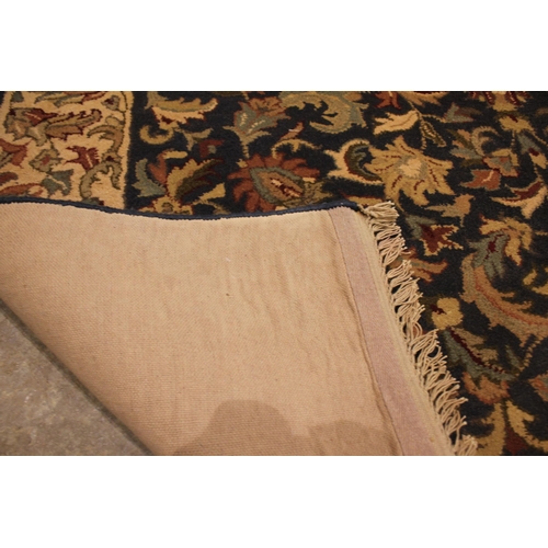 723 - A handmade Indian wool pile tea washed Jaipur rug, the all over floral design in autumnal shades upo... 