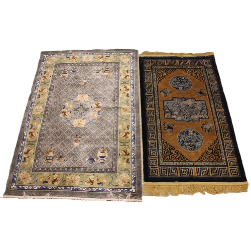 738 - Two Chinese silk work rugs, the first with a central grey field and central foliate medallion, enclo... 