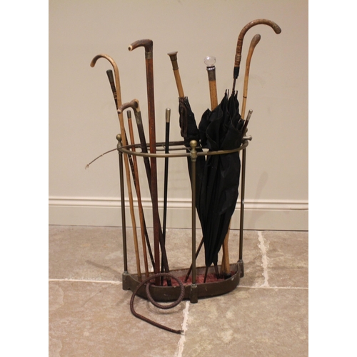 671 - A collection of walking sticks, canes and parasols to a Victorian brass stick stand, to include; a '... 