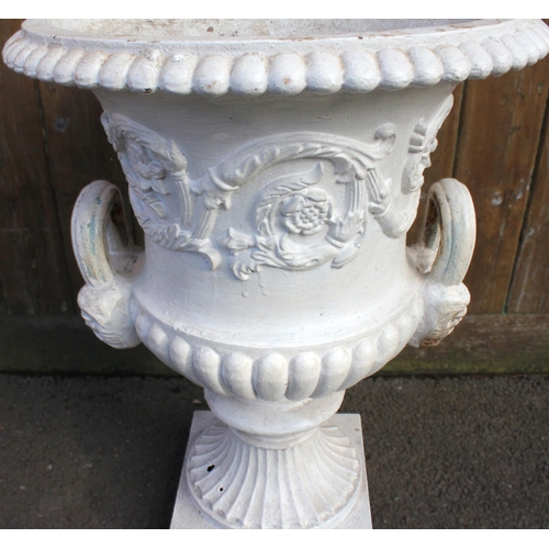 923 - A Victorian cast iron campana urn in the manner of Andrew Handyside, of typical form, the gadrooned ... 