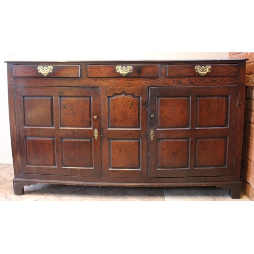 782 - An 18th century oak dresser base, the twin plank moulded top over three lip moulded frieze drawers a... 