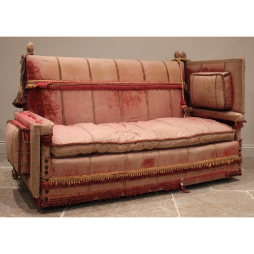 860 - An 18th century knoll or Knole sofa, in pink velour fabric applied with tassel fringes, the straight... 