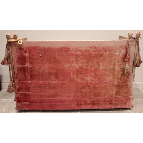 860 - An 18th century knoll or Knole sofa, in pink velour fabric applied with tassel fringes, the straight... 