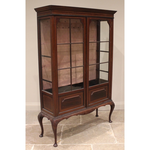 897 - An Edwardian mahogany display cabinet, outlined with inlaid chevron banding, the pair of astragal gl... 