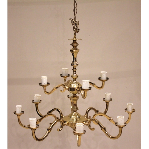 691 - A gilt brass chandelier, 20th century, formed with a central column and two graduated tiers of 'S' s... 