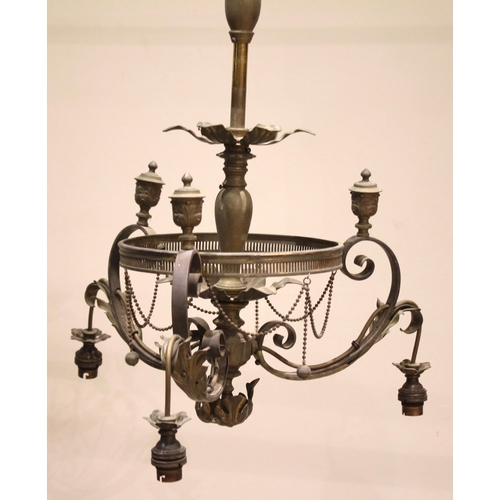 694 - A brass three branch ceiling light fitting, early 20th century, the central baluster column with pet... 