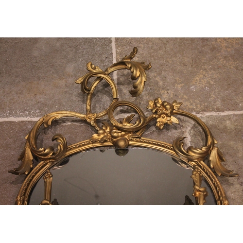 711 - A 19th century giltwood and gesso mirrored wall shelf, the openwork interlaced foliate crest over an... 