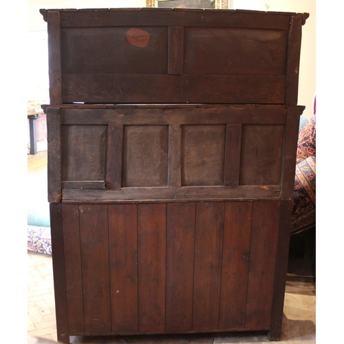 783 - A Welsh joined oak cwpwrdd tridarn, early 18th century, the upper tier with a panel back and shelf, ... 