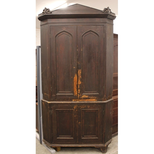 832 - A 19th century scumbled pine freestanding corner cupboard, the architectural cornice over a pair of ... 