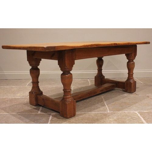 880 - A 19th century style pine refectory table, the cleated plank top upon ring turned baluster and block... 