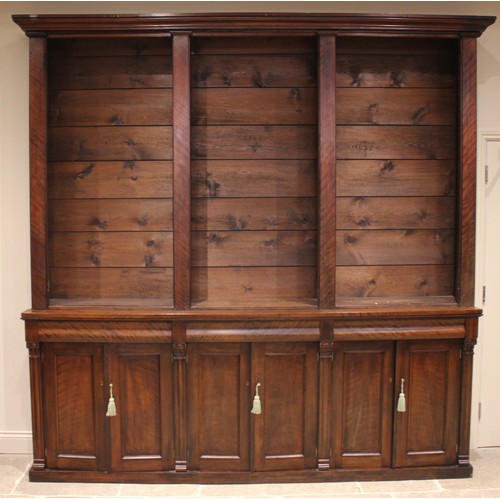 876 - A Victorian mahogany glazed library bookcase, of country house proportions, the moulded cornice over... 