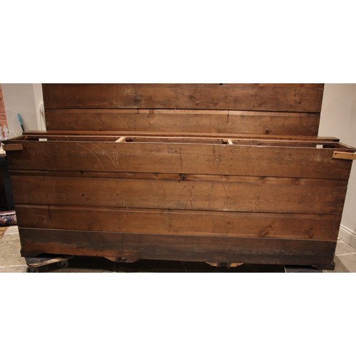 876 - A Victorian mahogany glazed library bookcase, of country house proportions, the moulded cornice over... 