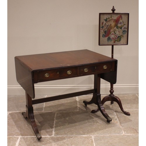 874 - A Regency style mahogany sofa table, the drop leaf top with a reeded edge over a pair of frieze draw... 