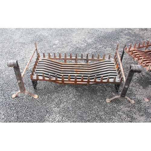 750 - A pair of wrought iron blacksmith made fire dogs of country house proportions, early 20th century, t... 