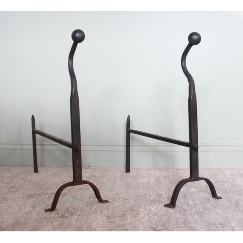 750 - A pair of wrought iron blacksmith made fire dogs of country house proportions, early 20th century, t... 