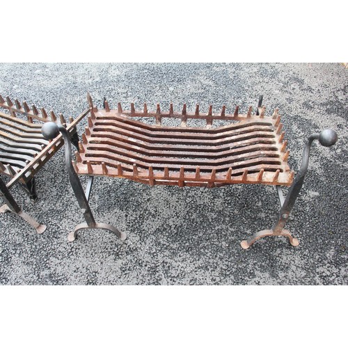 750 - A pair of wrought iron blacksmith made fire dogs of country house proportions, early 20th century, t... 