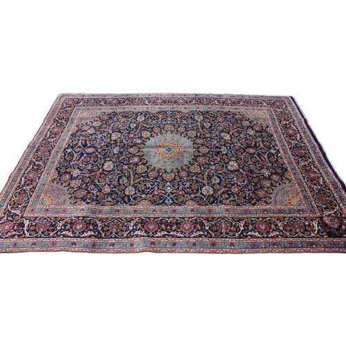 714 - A rich blue ground Persian Kashan carpet, the Shabazz lozenge medallion on a royal blue ground with ... 