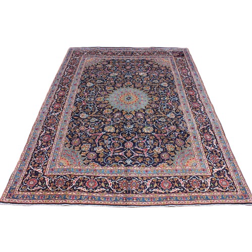 714 - A rich blue ground Persian Kashan carpet, the Shabazz lozenge medallion on a royal blue ground with ... 