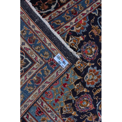 714 - A rich blue ground Persian Kashan carpet, the Shabazz lozenge medallion on a royal blue ground with ... 